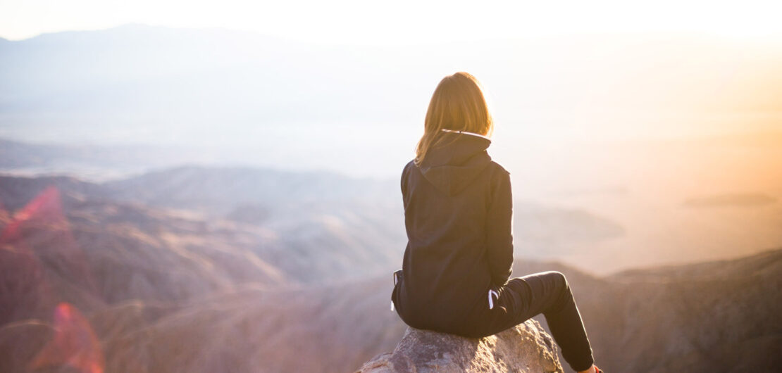 Woman sitting on rock help Anxiety Stress Burnout
