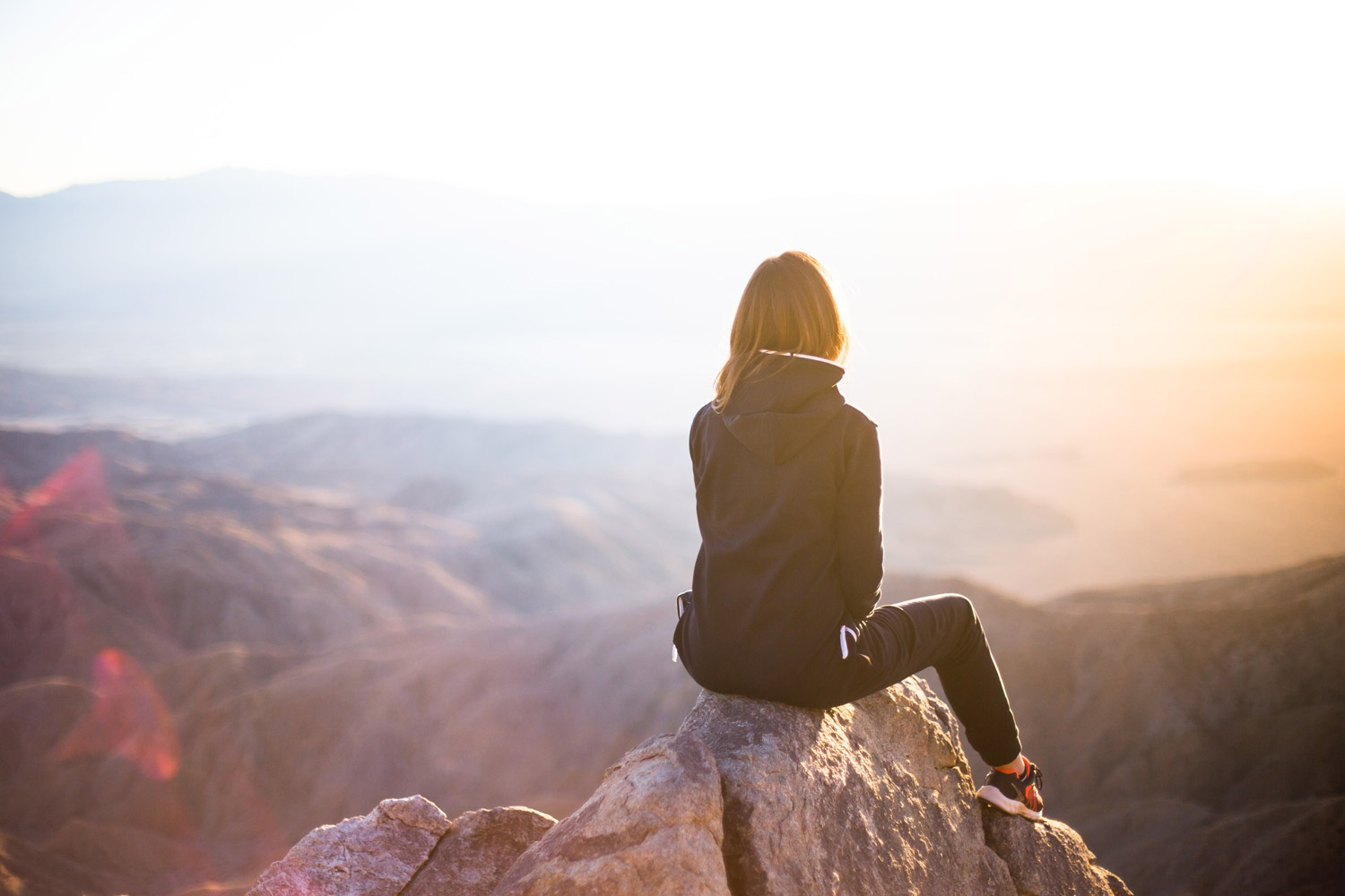 Woman sitting on rock help Anxiety Stress Burnout