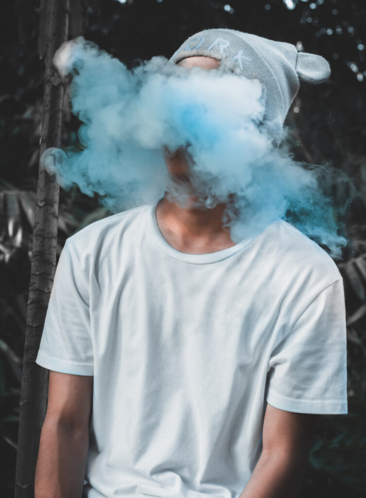 Person smoking blue smoke